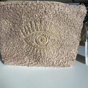 Make up tas  beige met goudkleurig oog